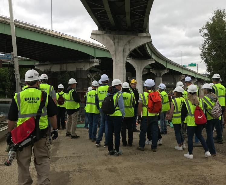 Picture of Educators Participating in Externship on Job Site Wearing Safety Vests and Hard Hats