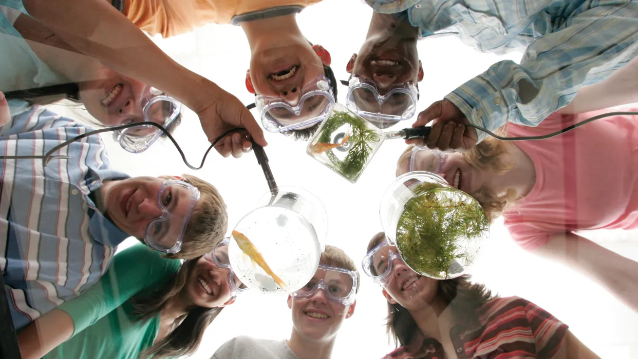 Action photo of high school students in chemistry lab wearing safety goggles and hair tied back, photo provided by Vernier in partnership with South Metro Salem STEM